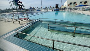 A swimming pool with lanes, a lifeguard chair, and a fenced area. - WaterFront Boundary vacation! Close to beaches 3bdr2bath,golfing fishing (Rotonda West)