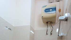 Standard Double Room | Bathroom | Shower, free toiletries, slippers, towels