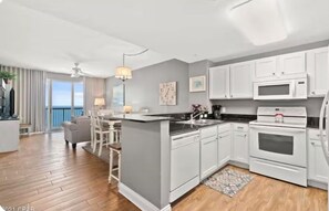 Kitchen Dining Room Living Room Area - OCEAN FRONT PROPERTY next to Pier Park with pools, tiki bars (Panama City)