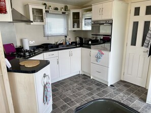 Fridge, microwave, oven, stovetop - Home from home static caravan at Skipsea Sands Holiday Park (pet friendly) (Skipsea)