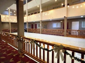 Experience the hotel's modern design with leaf-patterned carpeting and stylish balconies.