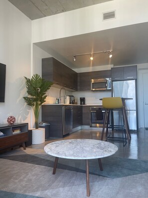 Enjoy cooking in this well-equipped kitchen with a sink, microwave, and oven.