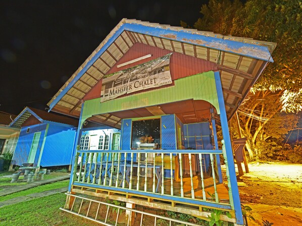Welcome to Mahseer Chalet, a charming single-story retreat with a cozy porch and scenic surroundings.