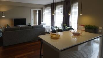 Superior Apartment | Living area | 50-inch LCD TV with digital channels, TV, heated floors