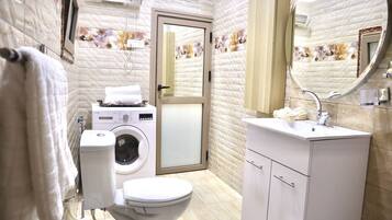 Combined shower/tub, hair dryer, towels, soap