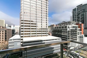A high-rise building with multiple floors, large windows, and a modern architectural design.