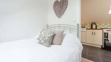 Apartemen | 1 kamar tidur, setrika/meja setrika, Wi-Fi gratis, dan seprai linen