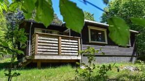 A cabin with a deck, a window, and a door. - Amazing Home in Mollaryd With 2 Bedrooms and Wifi (Ljung)