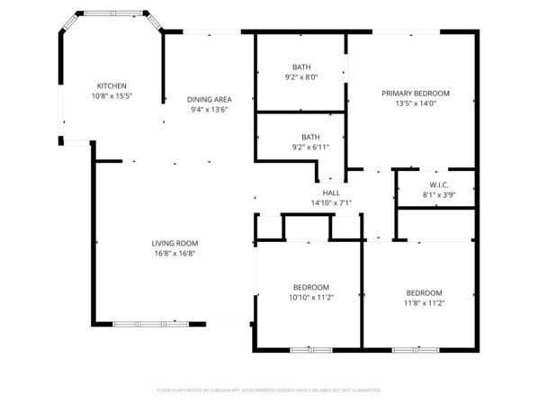 A floor plan with a kitchen, dining area, living room, two bathrooms, a primary bedroom, a hall, and two additional bedrooms.