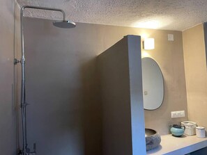 A bathroom with a shower, a mirror, and a countertop with a bowl, a teapot, and a container. - Charming two Bedroom Fisherman's House on Kea (Kea)