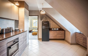 Apartamento | Cozinha privada | Geladeira