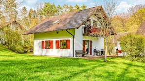 A white house with red shutters, a balcony, and a chimney. - Awesome Home in Kirchheim With 4 Bedrooms, Sauna and Wifi (Kirchheim)
