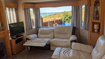 Apartment, Mehrere Betten | Wohnzimmer