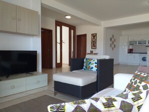 Family Apartment, 2 Bedrooms, 2 Bathrooms, Beachside | Living area | TV - Swyn - The Flat Close To The Beach (Boa Vista)