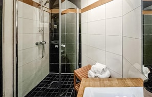 A modern bathroom with a glass-enclosed shower, a wooden vanity, and a white bathtub. - Awesome Home in Hemsedal With 5 Bedrooms, Sauna and Wifi (Hemsedal)