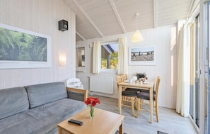 Ferienhaus | Wohnzimmer | Fernseher, Kamin