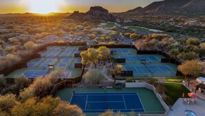 A tennis court complex with multiple courts, surrounded by trees and a mountainous backdrop. - The Boulders Villa-Scottsdale-Private Pool/Spa-Golf⛳️ (Scottsdale)