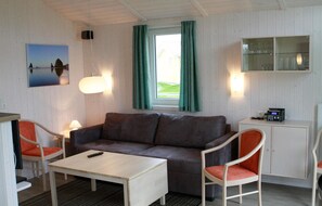 Ferienhaus (Freibeuterweg 13 - Dorf 5) | Wohnzimmer | Kamin
