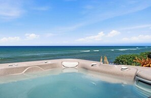 A hot tub with a view of the ocean.