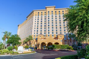 Stunning hotel with a grand central entrance and beautifully landscaped surroundings.