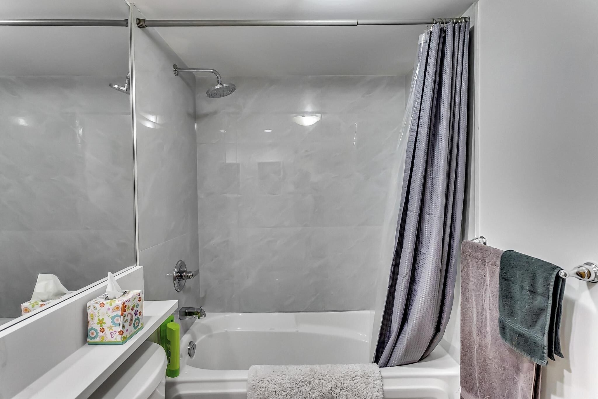 Combined shower/tub, hair dryer, towels, soap
