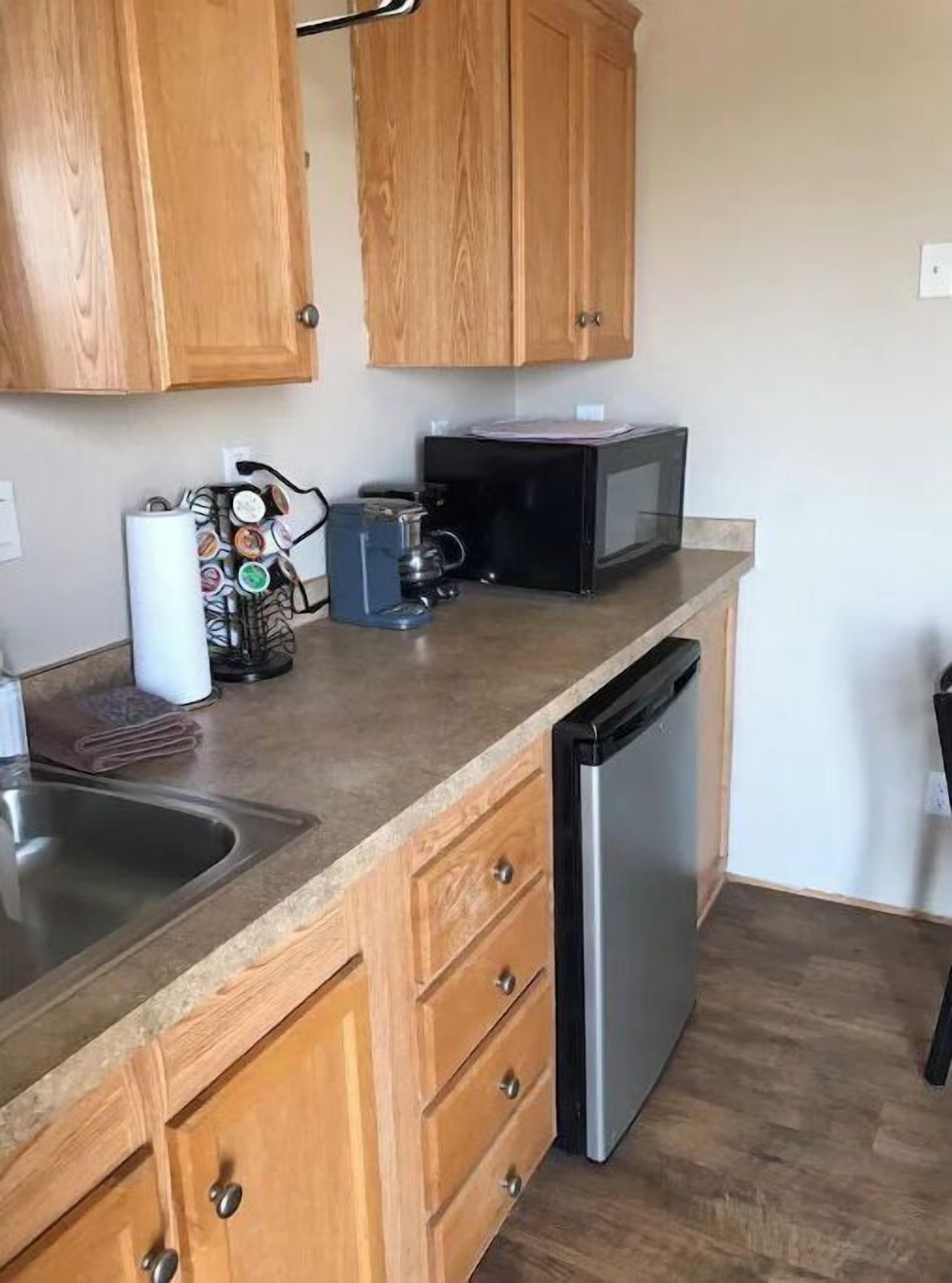 Fridge, microwave, stovetop, cookware/dishes/utensils