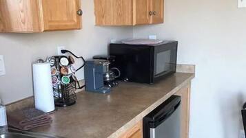 Fridge, microwave, stovetop, cookware/dishes/utensils