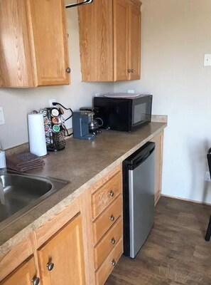 Fridge, microwave, stovetop, cookware/dishes/utensils