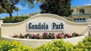 A sign for 'Gondola Park' with a curved top and a flower bed in front. - Luxurious 3br 2bath Condo minutes to beautiful Venice beaches, Downtown Shopping (Venice)