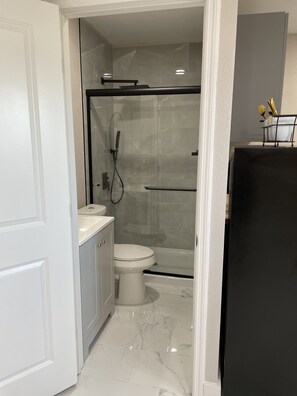 Shower, towels, soap, toilet paper