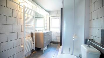 Bathtub, hair dryer, toilet paper