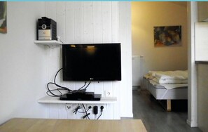 Apartment (Schmugglerstieg 9c - Dorf 5) | Wohnzimmer | Fernseher, Kamin