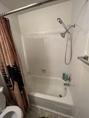 Bathtub, hair dryer, towels, soap - One bedroom top floor condo with Mountain View from bedroom and covered parking (Anchorage)