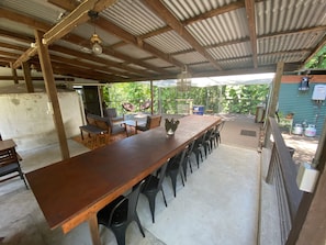 Enjoy meals al fresco in a serene garden setting with a spacious dining area.