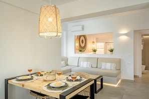 Apartment | Living area | 42-inch LED TV with satellite channels, TV - THEALOS SANTORINI (Santorini)