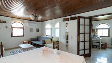 Family Room, Non Smoking, Partial Sea View | Free WiFi, bed sheets