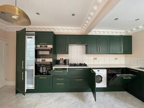 Enjoy cooking in this well-equipped kitchen with an oven, microwave, and dishwasher.