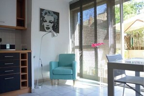 Enjoy a meal at the dining table or relax in the armchair by the window.
