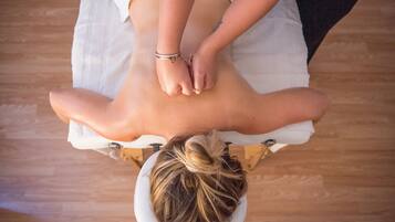 Guests can enjoy a rejuvenating massage on a comfortable massage table.