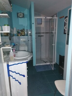 Bathtub, hair dryer, towels, soap