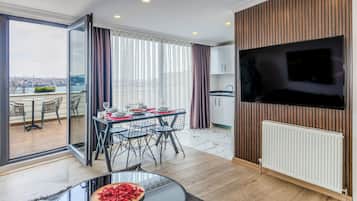 Family Penthouse | Living area | 130-inch Smart TV with satellite channels, TV
