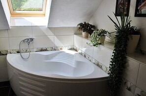 Bathtub, hair dryer, towels, soap