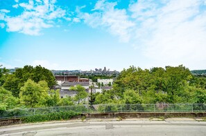 A view of a cityscape with buildings and trees.