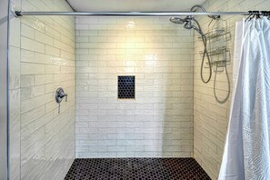 Combined shower/tub, hair dryer, towels, soap
