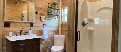 Shower, towels, shampoo, toilet paper