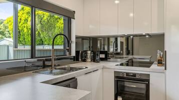 Coffee/tea maker, fridge, microwave, oven
