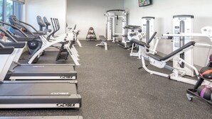 A gym with treadmills, weight machines, and a stationary bike. - Margarittaville Las Vegas  (Las Vegas)