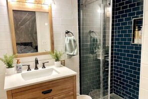 Combined shower/tub, hair dryer, towels, soap