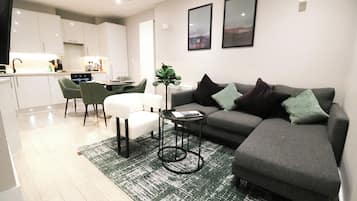 Apartment, 2 Bedrooms | Living area | 42-inch TV with satellite channels