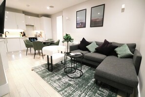 Apartment, 2 Bedrooms | Living area | 42-inch TV with satellite channels